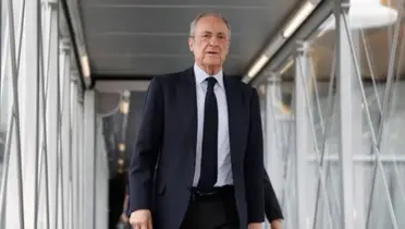 Florentino Perez looks serious as he walks from the airport.
